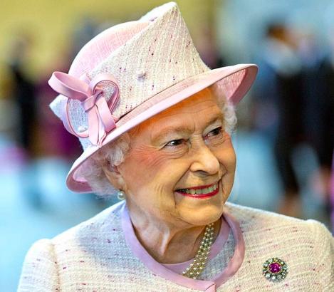 Queen Elizabeth II at the Palace of Westminster viewing the Diamond Jubilee Window which has been installed in the Great Window of Westminister Hall.